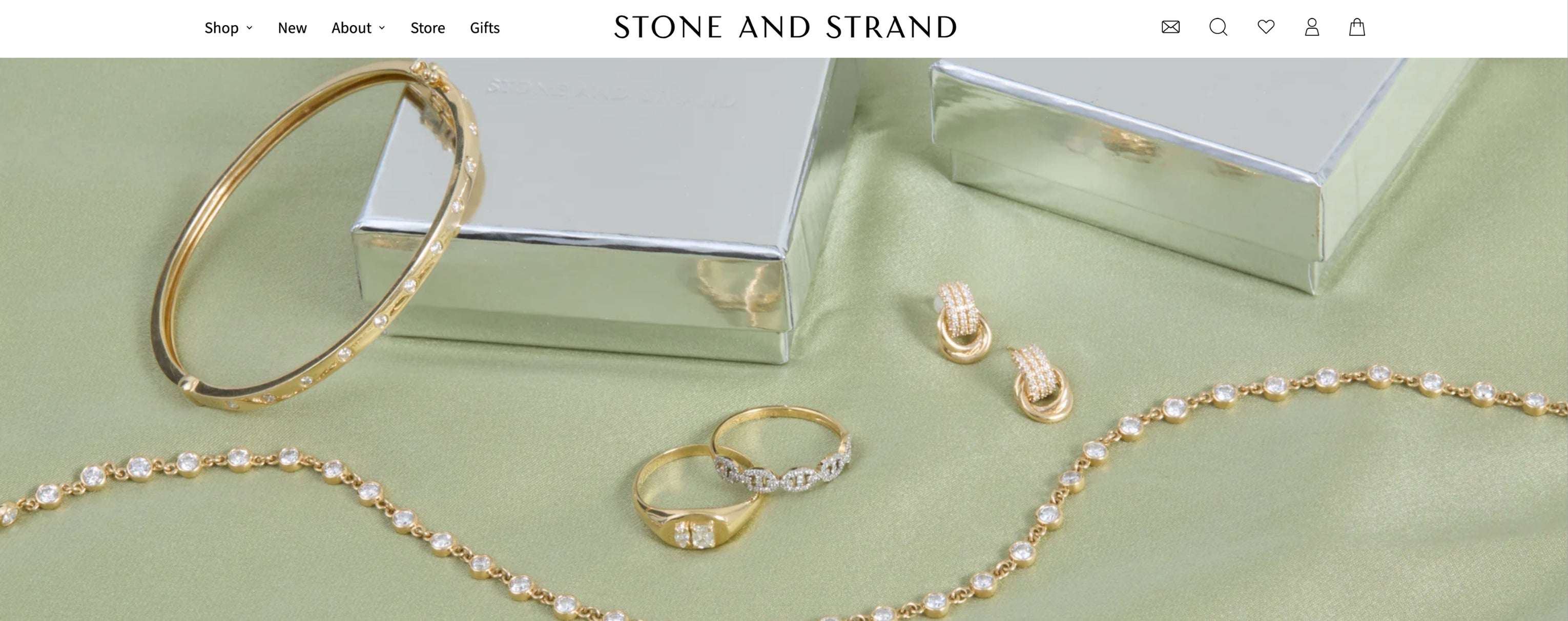 Shopify jewelry websites product page example with reviews, trust badges and add to cart section